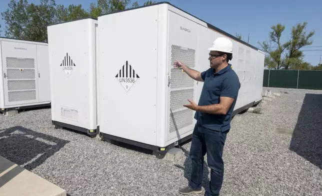 Chris Linsmayer, Key Capture Energy Public Affairs Manager, talks about the company's large lithium battery energy storage system, Tuesday, Sept. 9, 2025 in Blasdell, N.Y., which can power 15,000 homes for two hours during outages or high demand. (AP Photo/Ted Shaffrey)