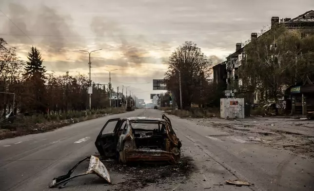 In this photo taken on Oct.13, 2025 and provided by Ukraine's 24th Mechanized Brigade press service, a damaged private car is seen in Kostiantynivka, a frontline town where some 5000 people still stay with no water, electricity and gas supply in the site of heaviest battles with the Russian troops in the Donetsk region, Ukraine. (Oleg Petrasiuk/Ukraine's 24th Mechanized Brigade via AP)