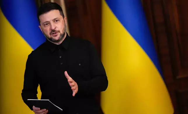 Ukraine's President Volodymyr Zelenskyy speaks during a news conference with High Representative of the European Union for Foreign Affairs and Security Policy Kaja Kallas, not pictured, Monday, Oct. 13, 2025, in Kyiv, Ukraine. (AP Photo/Julia Demaree Nikhinson)