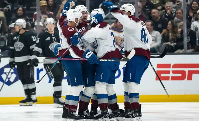 Colorado Avalanche players celebrate a goal by center Martin Necas (88) during the second period of an NHL hockey game against the Los Angeles Kings, Tuesday, Oct. 7, 2025, in Los Angeles. (AP Photo/Kyusung Gong)