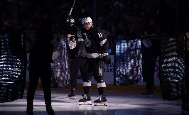 Los Angeles Kings center Anze Kopitar (11) is introduced before an NHL hockey game against Colorado Avalanche, Tuesday, Oct. 7, 2025, in Los Angeles. (AP Photo/Kyusung Gong)