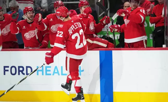 Detroit Red Wings center Mason Appleton (22) celebrates his goal against the Florida Panthers in the second period of an NHL hockey game Wednesday, Oct. 15, 2025, in Detroit. (AP Photo/Paul Sancya)