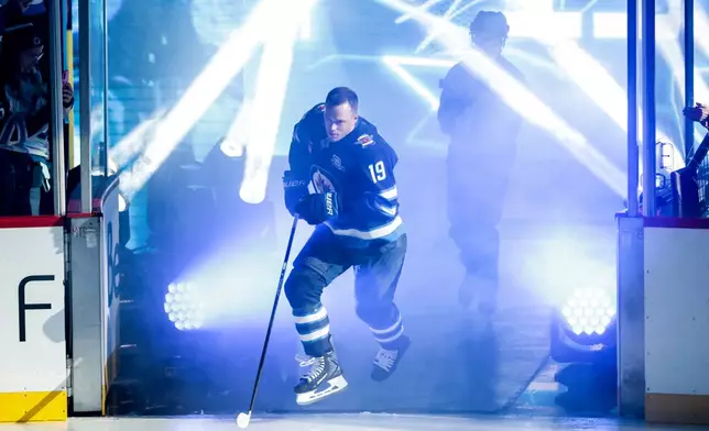 Winnipeg Jets' Jonathan Toews (19) is introduced prior to NHL hockey game action against the Dallas Stars in Winnipeg, Manitoba, Thursday, Oct. 9, 2025. (John Woods/The Canadian Press via AP)