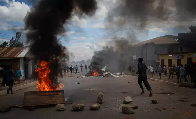 People protest in the streets of Arusha, Tanzania, on election day Wednesday, Oct. 29, 2025. (AP Photo/str)