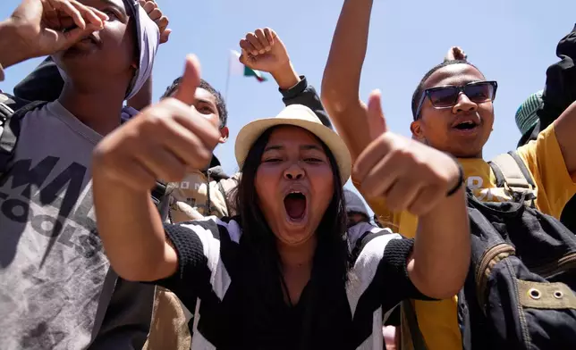 Shaniah Rakotohania, 18-year-old university student at Lycee Technique Alarabia, gestures during a protest calling for President Andry Rajoelina to step down in Antananarivo, Madagascar, Tuesday, Oct. 14, 2025. (AP Photo/Brian Inganga)