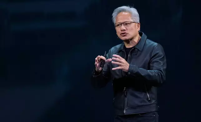 NVIDIA CEO Jensen Huang speaks on how AI infrastructure and AI factories that generate intelligence at scale are powering a new industrial revolution, at Washington Convention Center, Tuesday, Oct. 28, 2025, in Washington. (AP Photo/Manuel Balce Ceneta)