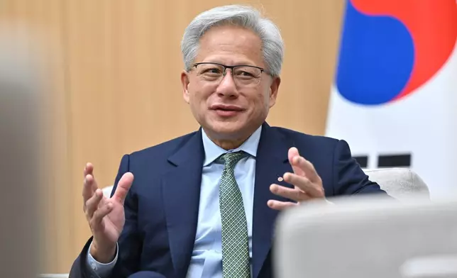 Nvidia CEO Jensen Huang meets with South Korean President Lee Jae Myung on the sidelines of the Asia-Pacific Economic Cooperation (APEC) summit in Gyeongju, South Korea Friday, Oct. 31, 2025. (Jung Yeon-je/Pool Photo via AP)