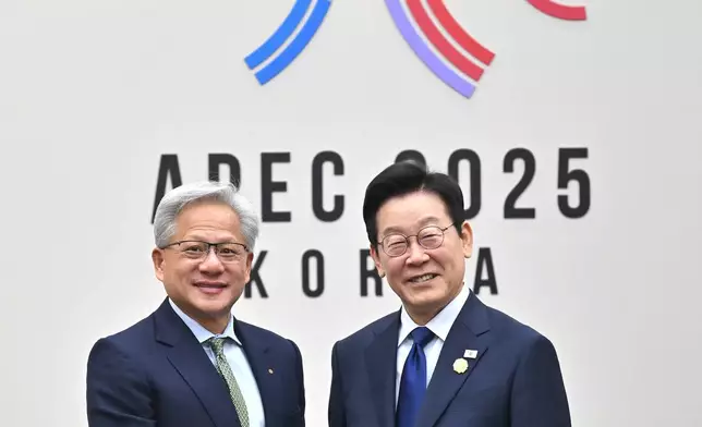 South Korean President Lee Jae Myung, right, shakes hands with Nvidia CEO Jensen Huang during their meeting on the sidelines of the Asia-Pacific Economic Cooperation (APEC) summit in Gyeongju, South Korea Friday, Oct. 31, 2025. (Jung Yeon-je/Pool Photo via AP)