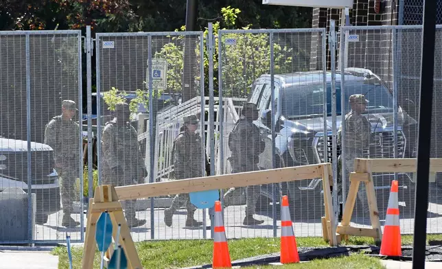Personnel walk inside an immigration processing facility in Broadview, Ill., Thursday, Oct. 9, 2025. (AP Photo/Paul Beaty)