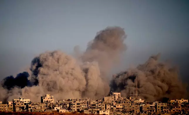 Smoke rises following an Israeli military strike in the northern Gaza Strip, seen from southern Israel, Wednesday, Oct. 8, 2025. (AP Photo/Emilio Morenatti)