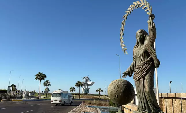 A vehicle passes at Peace Square at the Red Sea city of Sharm el-Sheikh, Egypt, where Israeli and Hamas officials are set to hold indirect talks, Wednesday, Oct. 8, 2025. (AP Photo)