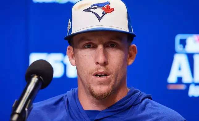 Toronto Blue Jays' Myles Straw speaks with the media ahead of Game 1 of baseball's American League Championship Series against the Seattle Mariners in Toronto, Saturday, Oct. 11, 2025. (Sammy Kogan/The Canadian Press via AP)