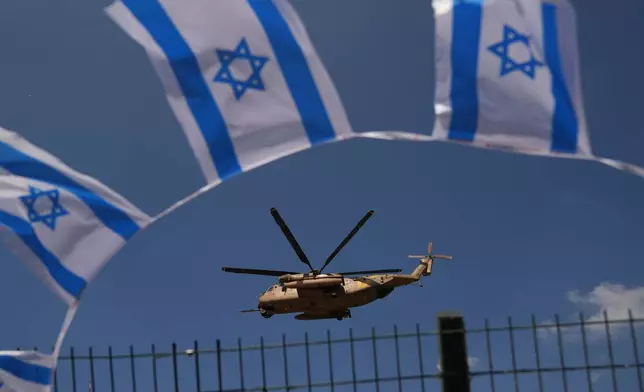 A military helicopter takes off from Beilinson Hospital in Petah Tikva, Israel, after transporting hostages released from Hamas captivity in the Gaza Strip, Monday, Oct. 13, 2025. (AP Photo/Francisco Seco)