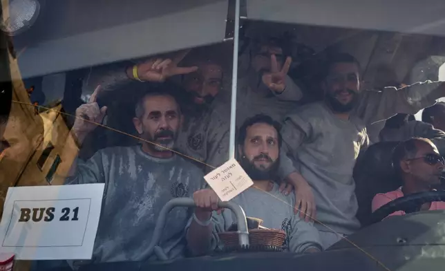 Freed Palestinian prisoners arrive in the Gaza Strip after their release from Israeli jails under a ceasefire agreement between Hamas and Israel, in Khan Younis, southern Gaza Strip, Monday, Oct. 13, 2025. (AP Photo/Jehad Alshrafi)