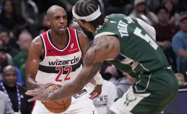 Washington Wizards' Khris Middleton fouls Milwaukee Bucks' Gary Trent Jr. during the first half of an NBA basketball game Wednesday, Oct. 22, 2025, in Milwaukee. (AP Photo/Morry Gash)