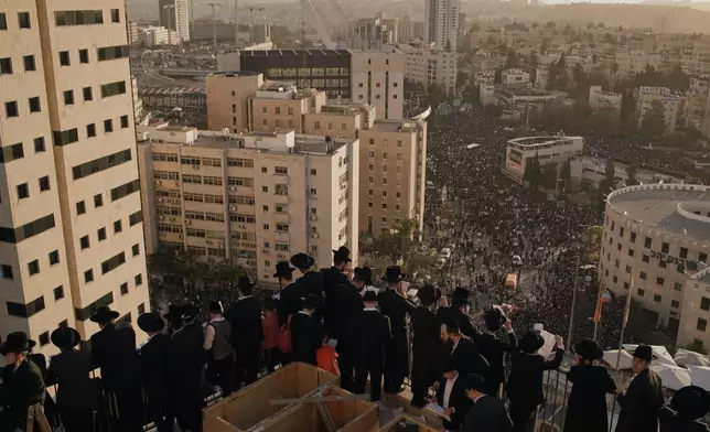 Ultra-Orthodox Jewish men attend a rally against plans to force them to serve in the Israeli military, in Jerusalem, Thursday, Oct. 30, 2025. (AP Photo/Leo Correa)
