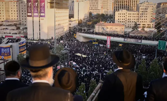 Ultra-Orthodox Jewish men attend a rally against plans to force them to serve in the Israeli military, in Jerusalem, Thursday, Oct. 30, 2025. (AP Photo/Ohad Zwigenberg)