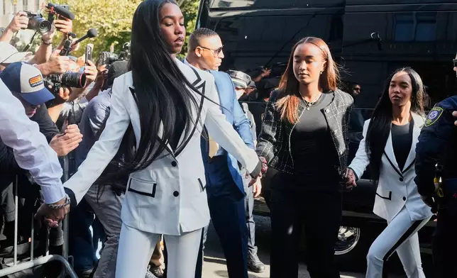 The twin daughters of Sean "Diddy" Combs, arrive at Federal Court, in New York, Friday, Oct. 3, 2025. (AP Photo/Richard Drew)