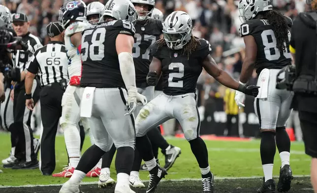 Las Vegas Raiders running back Ashton Jeanty (2) celebrates after scoring a touchdown against the the Tennessee Titans during the second half of an NFL football game, Sunday, Oct. 12, 2025, in Las Vegas. (AP Photo/Rick Scuteri)