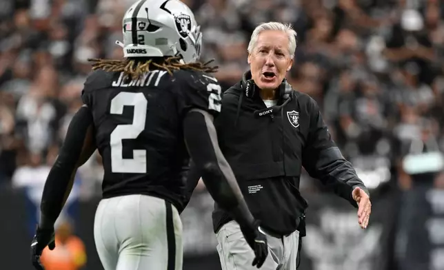 Las Vegas Raiders head coach Pete Carroll celebrates after Las Vegas Raiders running back Ashton Jeanty (2) scored a touchdown against the Tennessee Titans during the second half of an NFL football game, Sunday, Oct. 12, 2025, in Las Vegas. (AP Photo/David Becker)