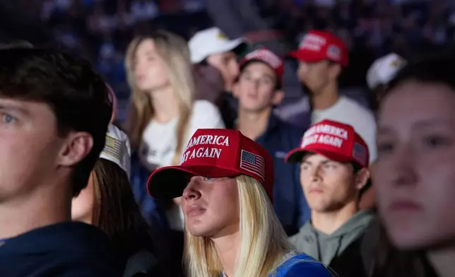 Attendees listen as Vice President JD Vance speaks during a "This Is the Turning Point" campus tour event at the University of Mississippi, in Oxford, Miss., Wednesday, Oct. 29, 2025. (AP Photo/Gerald Herbert)