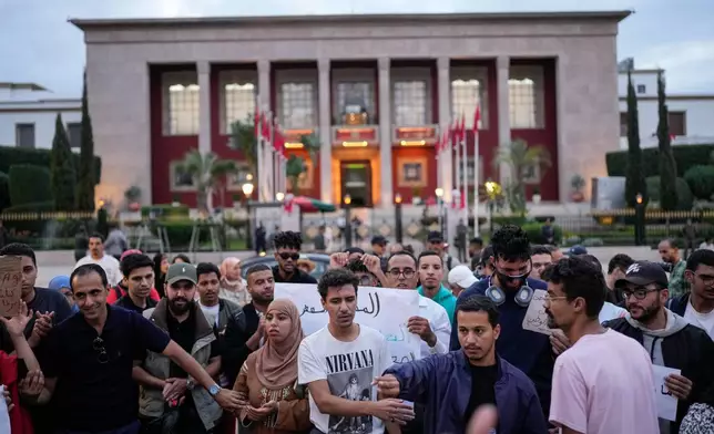 People take part in a youth-led protest against corruption and calling for education and healthcare reforms, in Rabat, Morocco, Thursday, Oct. 9, 2025. (AP Photo/Mosa'ab Elshamy)