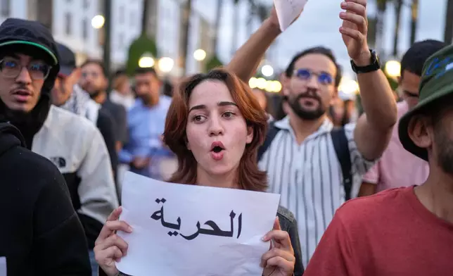 People take part in a youth-led protest against corruption and calling for education and healthcare reforms, in Rabat, Morocco, Thursday, Oct. 9, 2025. Banner in Arabic reads "Freedom". (AP Photo/Mosa'ab Elshamy)