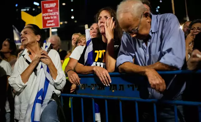 People attend a rally calling for the release of all hostages held by Hamas in the Gaza Strip and urges a ceasefire, in Tel Aviv, Israel, Saturday, Oct. 4, 2025. ahead of the second anniversary of the Israel-Hamas war. (AP Photo/Ohad Zwigenberg)
