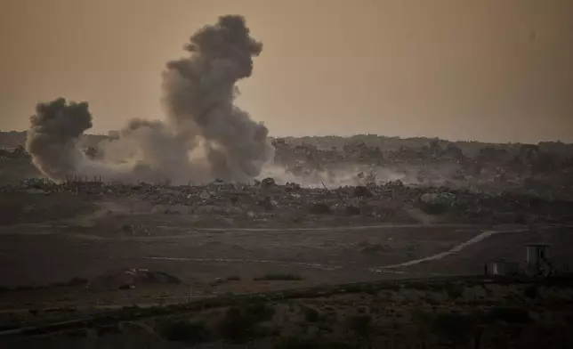 Smoke rises to the sky following an Israeli military strike in the northern Gaza Strip, as seen from southern Israel, Friday, Oct. 3, 2025. (AP Photo/Leo Correa)