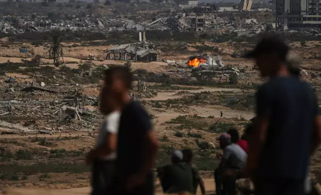 Fire and smoke rises following an Israeli army shelling in Nuseirat, central Gaza Strip, Saturday, Oct. 4, 2025.(AP Photo/Abdel Kareem Hana)