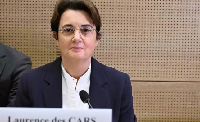 Laurence des Cars, director of Le Louvre museum, poses before a hearing at the Culture commission of the Senate, three days after historic jewels were stolen in a daring daylight heist, Wednesday, Oct. 22, 2025 in Paris. (AP Photo/Emma Da Silva)