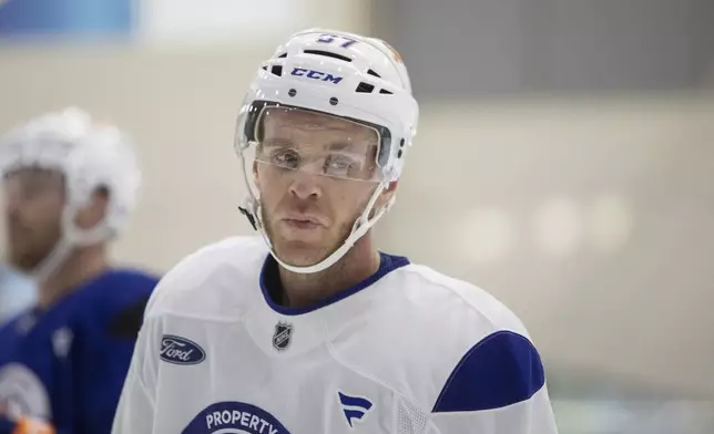 Edmonton Oilers' Connor McDavid (97) looks on during NHL hockey training camp in Edmonton, Alberta, Thursday, Sept. 18, 2025. (Amber Bracken/The Canadian Press via AP)