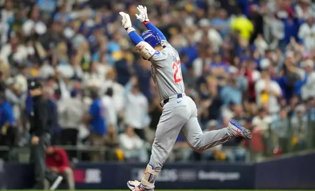 Chicago Cubs right fielder Seiya Suzuki (27) reacts after hitting a solo home run against the Milwaukee Brewers during the second inning of Game 5 of baseball's National League Division Series Saturday, Oct. 11, 2025, in Milwaukee. (AP Photo/Kayla Wolf)