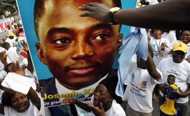 FILE - Supporters of Joseph Kabila dance at a political rally held July 22, 2006, in the Kinshasa, Democratic Republic of Congo. (AP Photo/Jerome Delay, file)