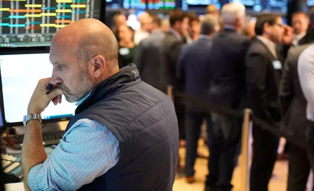 James Denaro works on the floor at the New York Stock Exchange in New York, Wednesday, Oct. 1, 2025. (AP Photo/Seth Wenig)