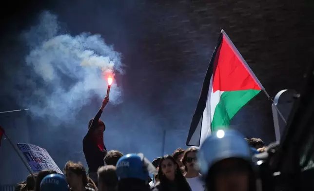 Pro-Palestinian demonstrators gather for a national general strike called by different unions to protest against the situation in Gaza two days after Israeli forces intercepted a Gaza-bound aid flotilla in the Mediterranean Sea, in Rome, Friday, Oct. 3, 2025. (AP Photo/Alessandra Tarantino)