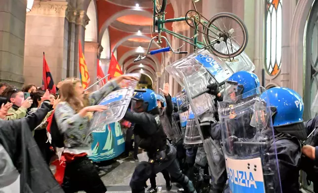 Police faceoff against people protesting in solidarity with the Global Sumud Flotilla on Wednesday, Oct. 1, 2025, in Turin, Italy, after ships were intercepted by the Israeli navy. (Matteo Secci/LaPresse via AP)