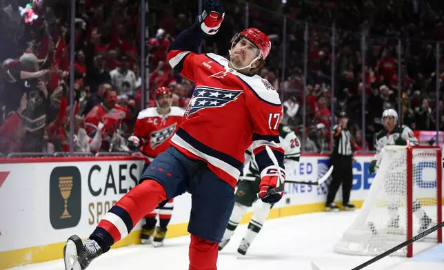 Washington Capitals center Dylan Strome (17) celebrates after his goal during the first period of an NHL hockey game against the Minnesota Wild, Friday, Oct. 17, 2025, in Washington. (AP Photo/Nick Wass)