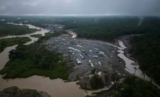 FILE - An illegal mining camp, sits along the Quito River, the Atrato River's main tributary, near Paimado, Colombia, Sept. 23, 2024. (AP Photo/Ivan Valencia, File)