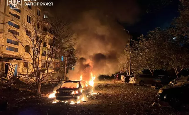 In this photo provided by the Ukrainian Emergency Service, fire and smoke raises after a residential building was damaged during Russia's air strike in Zaporizhzhia, Ukraine, Sunday, Oct. 5, 2025. (Ukrainian Emergency Service via AP)