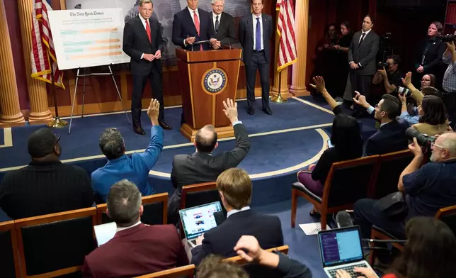 Senate Majority Leader John Thune, R-S.D., center, speaks to reporters about the government shutdown, Tuesday, Sept. 30, 2025, on Capitol Hill in Washington. (AP Photo/Jacquelyn Martin)