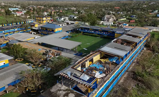 Parts of the roof of the St. Elizabeth Technical High School are missing in Santa Cruz, Jamaica, Wednesday, Oct. 29, 2025, after Hurricane Melissa passed. (AP Photo/Matias Delacroix)