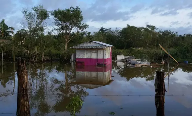 A house is flooded after Hurricane Melissa passed through Santa Cruz, Jamaica, Wednesday, Oct. 29, 2025. (AP Photo/Matias Delacroix),