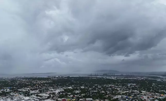 Clouds cover Kingston, Jamaica, ahead of the forecast arrival of Hurricane Melissa on Sunday, Oct. 26, 2025. (AP Photo/Matias Delacroix)