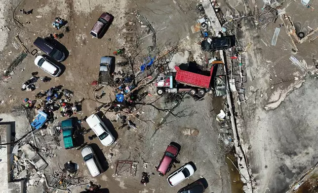 A truck lies overturned among debris in Black River, Jamaica, Thursday, Oct. 30, 2025, in the aftermath of Hurricane Melissa. (AP Photo/Matias Delacroix)