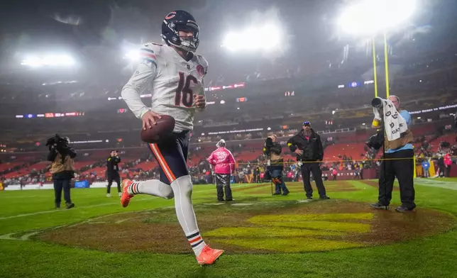 Chicago Bears kicker Jake Moody (16) runs off the field after an NFL football game against the Washington Commanders, Monday, Oct. 13, 2025, in Landover, Md. (AP Photo/Stephanie Scarbrough)