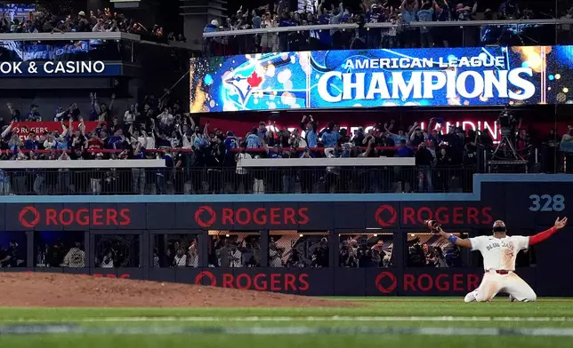 Toronto Blue Jays' Vladimir Guerrero Jr. celebrates after the final out of Game 7 of baseball's American League Championship Series, Monday, Oct. 20, 2025, in Toronto. (Nathan Denette/The Canadian Press via AP)