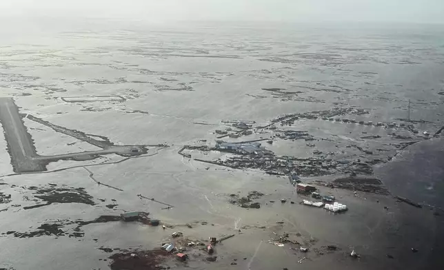 In this photo provided by the Defense Visual Information Distribution Service, Alaska Air National Guard rescue personnel conduct a search and rescue mission in Kipnuk, Alaska, on Monday, Oct. 13, 2025. (Defense Visual Information Distribution Service via AP)