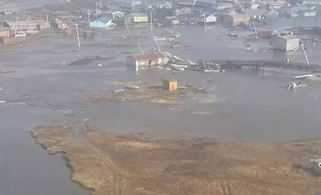 In this photo provided by the U.S. Coast Guard, Kipnuk, Alaska, experiences coastal flooding, Sunday, Oct. 12, 2025. (U.S. Coast Guard via AP)