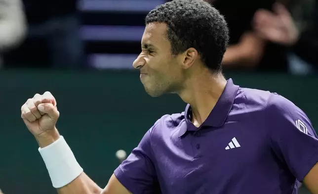 Felix Auger-Aliassime of Canada reacts after defeating Daniel Altmaier of Germany during their third round match at the Paris Masters tennis tournament at the Paris La Defense Arena, Thursday, Oct. 30, 2025, in Paris. (AP Photo/Michel Euler)